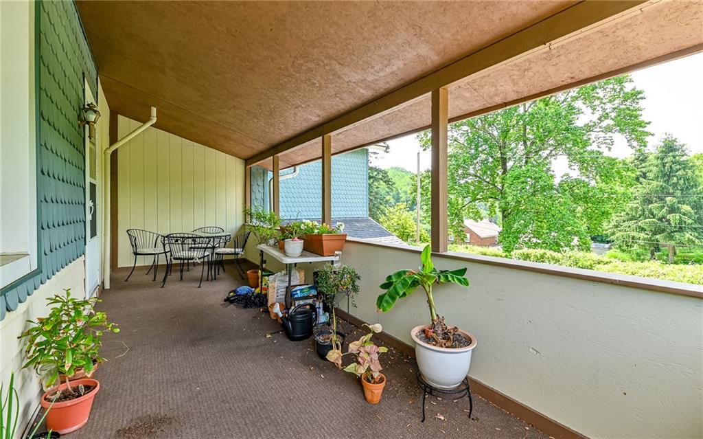 381 Friday Road Pittsburgh, PA 15209 - Photo 41 of 44 a living room with furniture and a potted plant