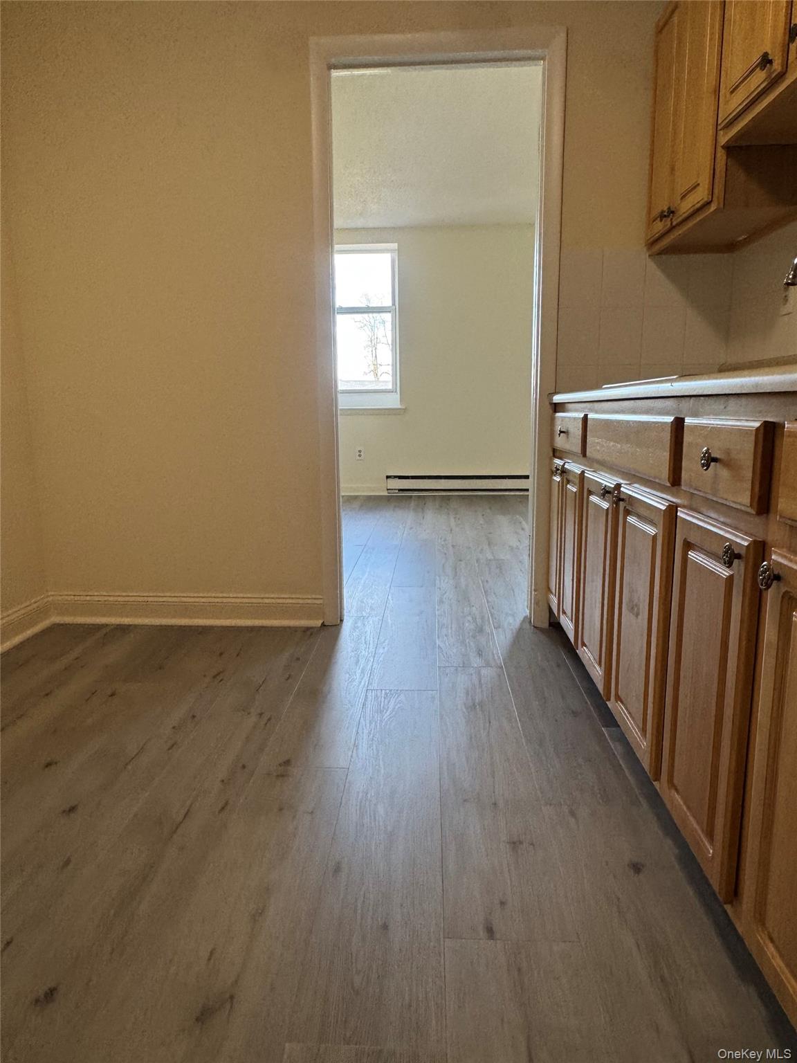 155 Main Street, Unit 1 Beacon, NY 12508 - Photo 2 of 11 a view of a room with wooden floor and white walls