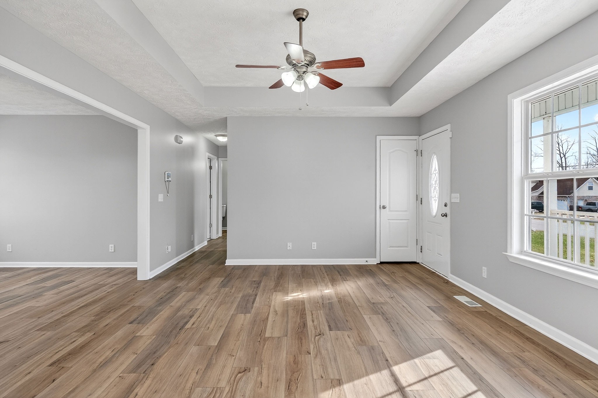 325 Indian Springs Circle Manchester, TN 37355 - Photo 5 of 29 a view of an empty room with wooden floor and a window