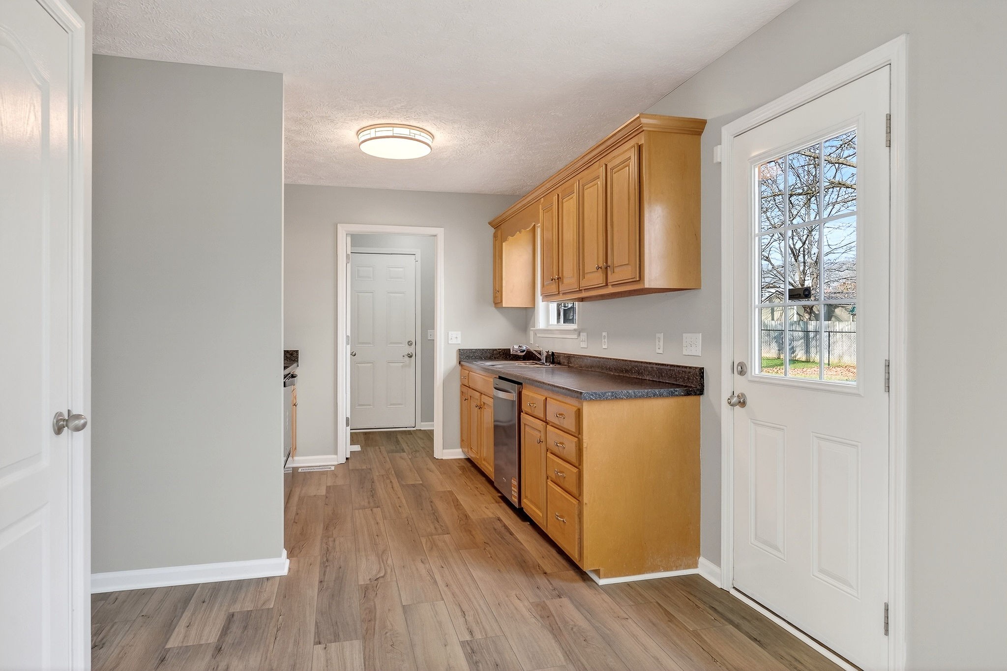 325 Indian Springs Circle Manchester, TN 37355 - Photo 7 of 29 a kitchen with wooden floors and white walls