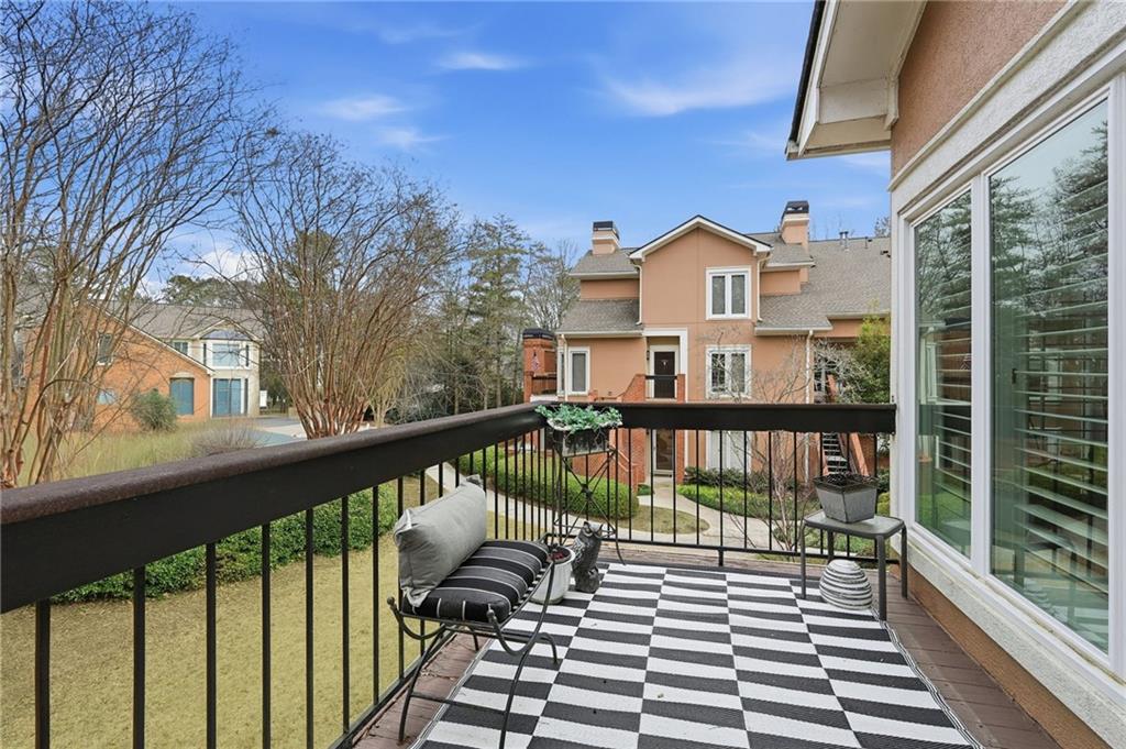 5264 Brooke Ridge Drive Dunwoody, GA 30338 - Photo 13 of 47 a view of a balcony with wooden floor and fence