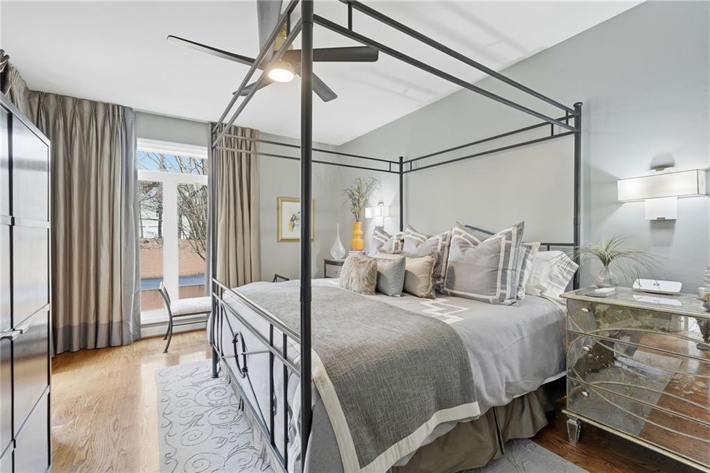5264 Brooke Ridge Drive Dunwoody, GA 30338 - Photo 15 of 47 a bedroom with a bed and a chandelier