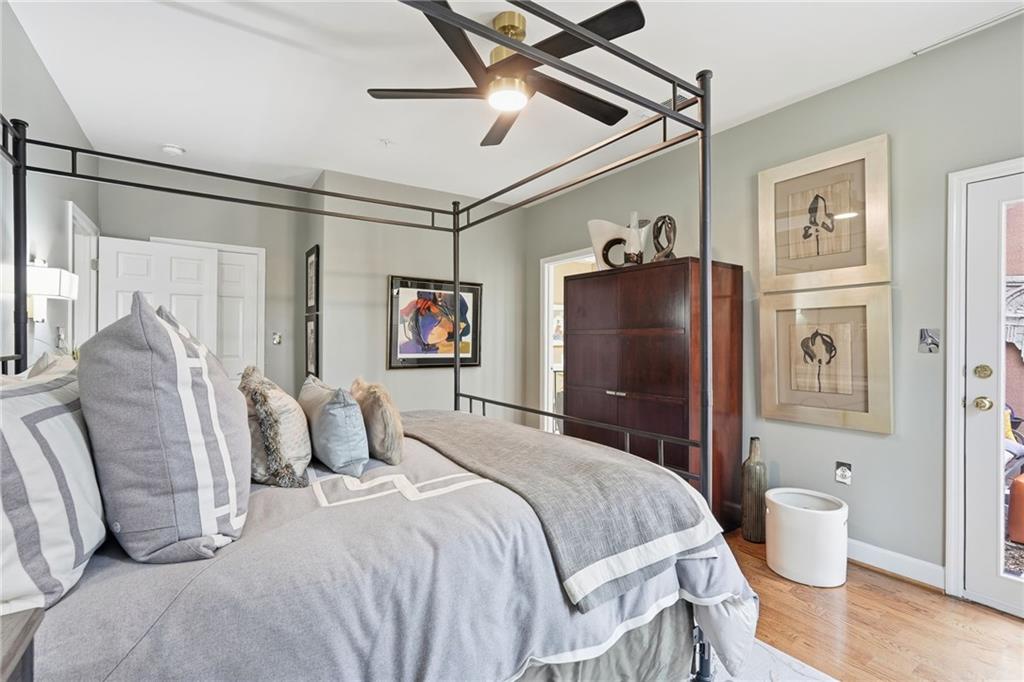 5264 Brooke Ridge Drive Dunwoody, GA 30338 - Photo 16 of 47 a bedroom with a bed and a chandelier