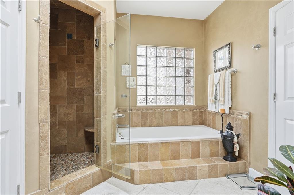 5264 Brooke Ridge Drive Dunwoody, GA 30338 - Photo 20 of 47 a spacious bathroom with sink and shower