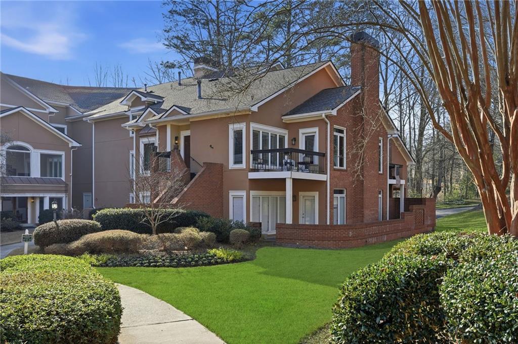 5264 Brooke Ridge Drive Dunwoody, GA 30338 - Photo 2 of 47 a front view of a house with a yard