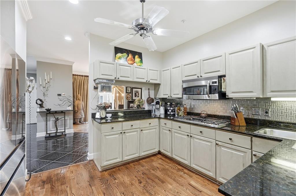 5264 Brooke Ridge Drive Dunwoody, GA 30338 - Photo 26 of 47 a kitchen with stainless steel appliances granite countertop a sink and cabinets