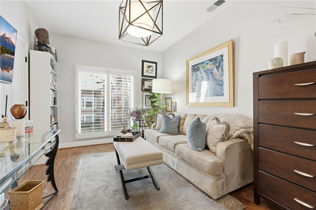 5264 Brooke Ridge Drive Dunwoody, GA 30338 - Photo 28 of 47 a living room with furniture a flat screen tv and a window