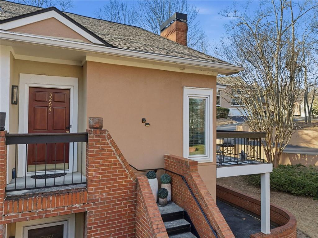 5264 Brooke Ridge Drive Dunwoody, GA 30338 - Photo 33 of 47 a view of a brick house with a large windows