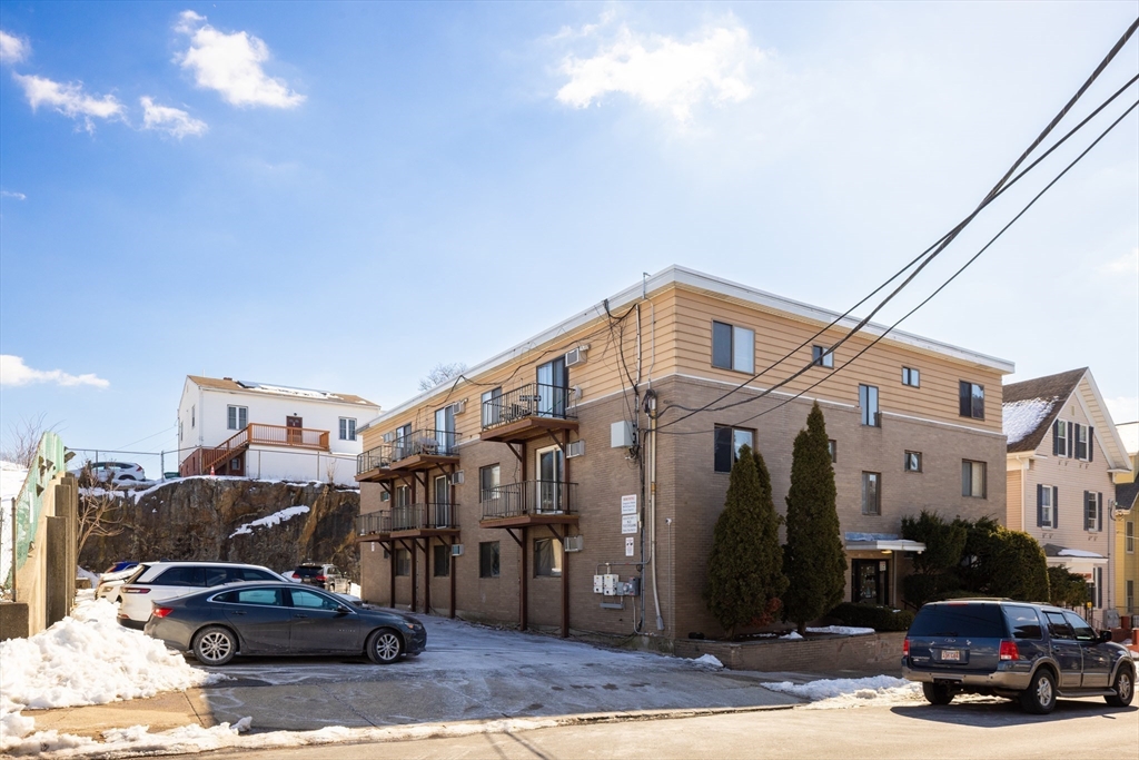 25 Hamilton Avenue Lynn, MA 01902 - Photo 2 of 5 a car parked in front of a building