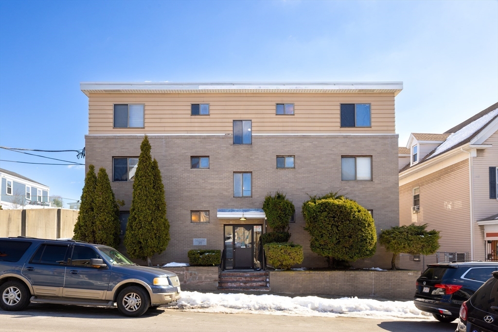 25 Hamilton Avenue Lynn, MA 01902 - Photo 3 of 5 a car parked in front of a house