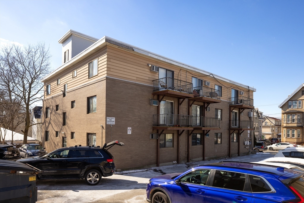 25 Hamilton Avenue Lynn, MA 01902 - Photo 4 of 5 a car parked in front of a building