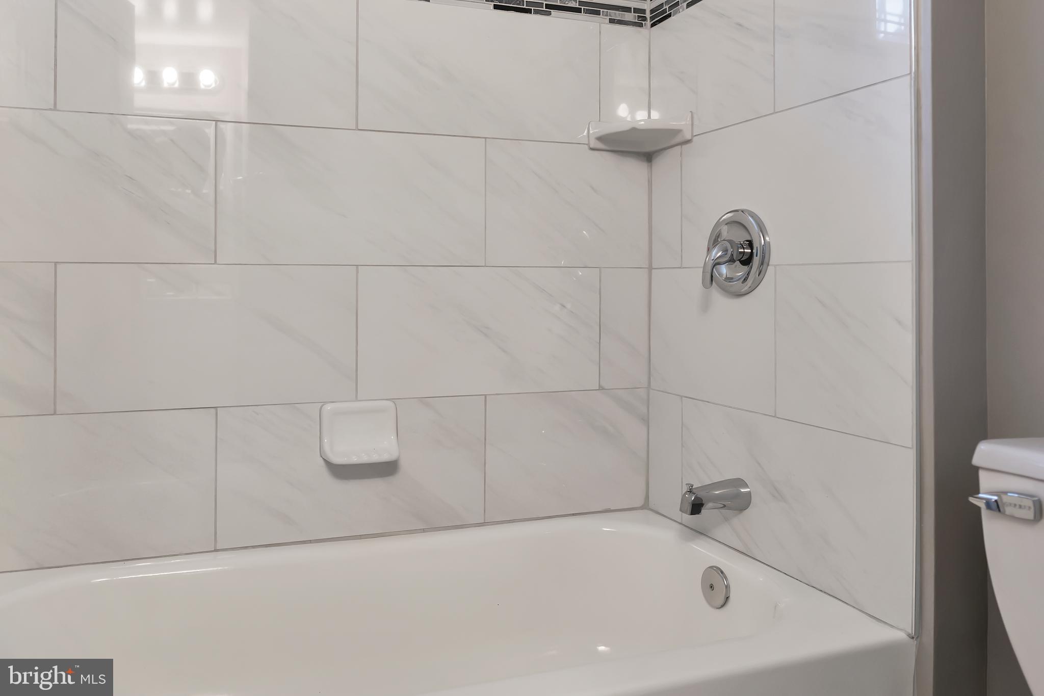 4516 Mountview Road Baltimore, MD 21229 - Photo 19 of 25 Tub View Of Upgraded Full Bathroom. Enclosure