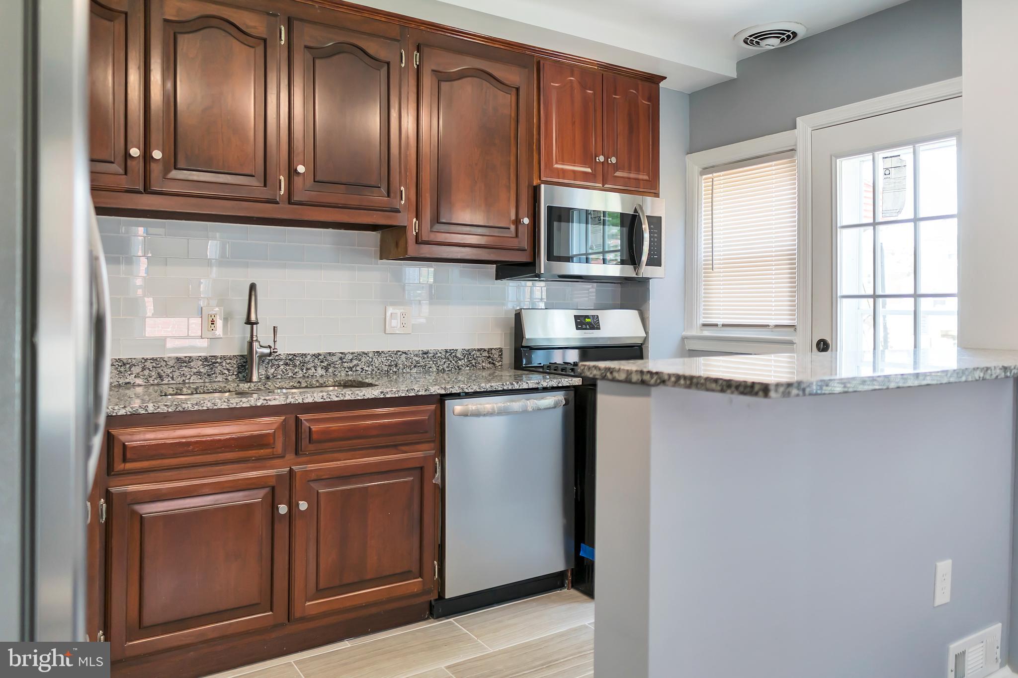 4516 Mountview Road Baltimore, MD 21229 - Photo 4 of 25 Full Renovated Kitchen Area With Serving Bar