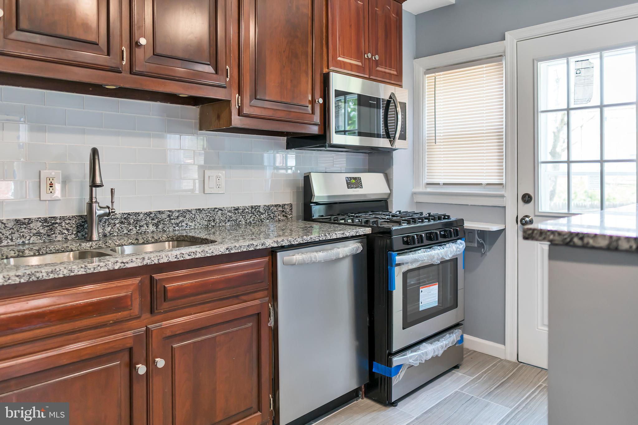 4516 Mountview Road Baltimore, MD 21229 - Photo 6 of 25 Kitchen Area With Side Door Exit