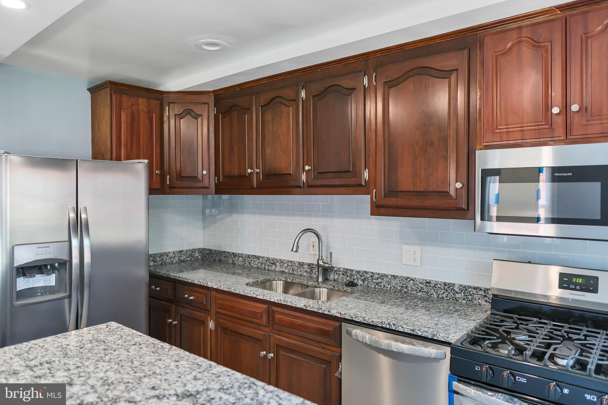 4516 Mountview Road Baltimore, MD 21229 - Photo 7 of 25 Kitchen Area w/ Stain Steel Appliances & Gas Stove