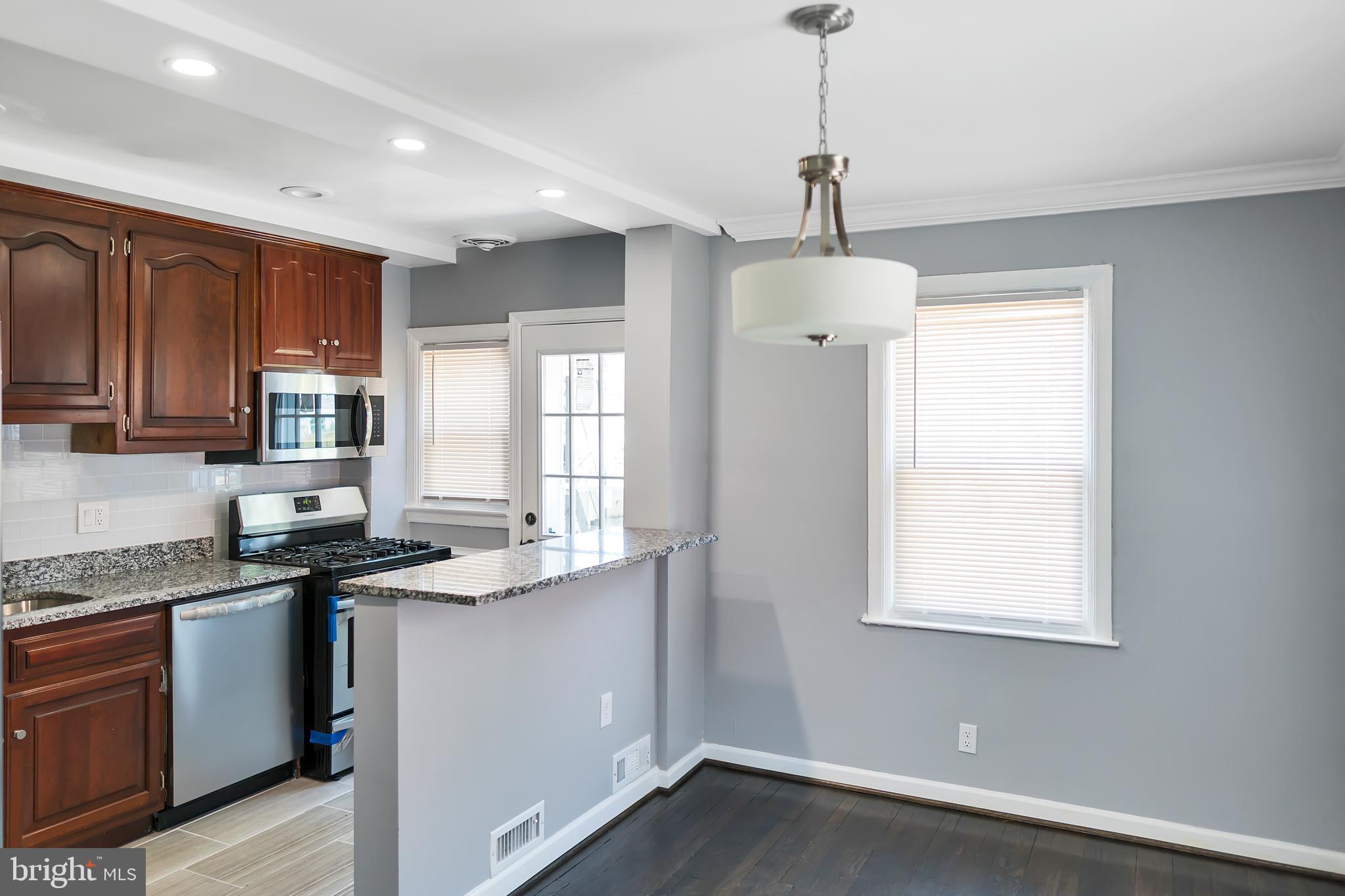 4516 Mountview Road Baltimore, MD 21229 - Photo 9 of 25 Dinning Rm. w/Upgraded Dark Flooring & Fresh Paint