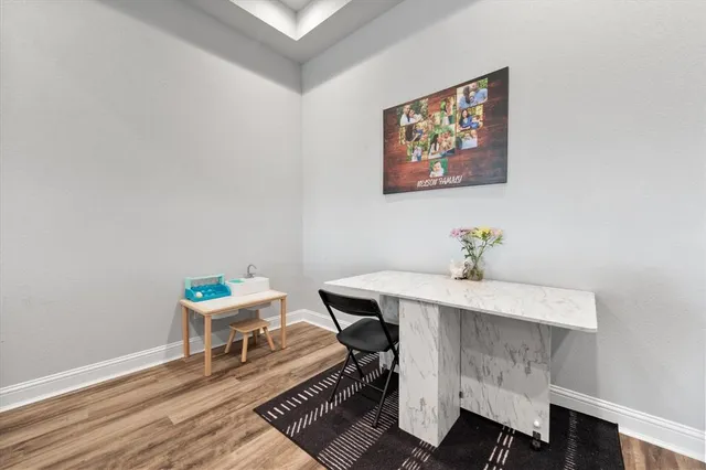 a spacious bedroom with a bed and a chandelier
