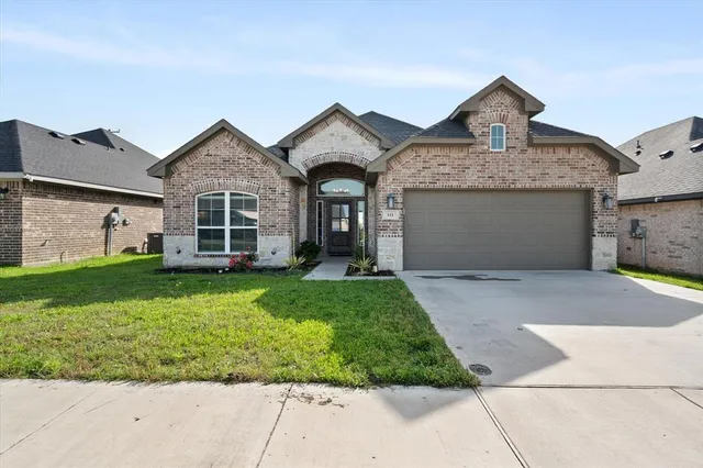 front view of a house with a yard