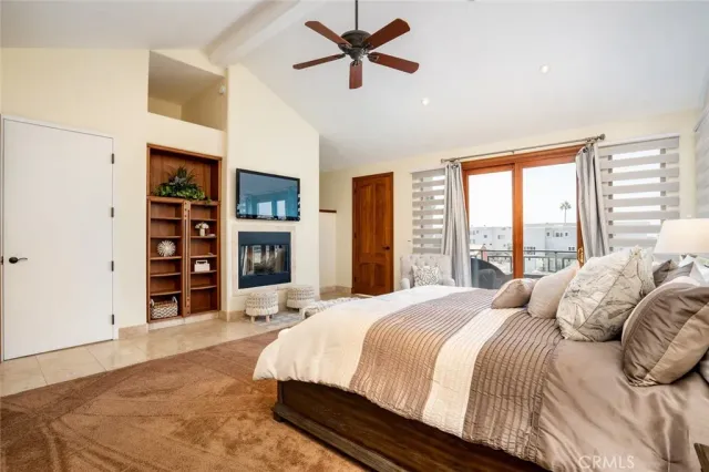 a bedroom with a bed couch and window