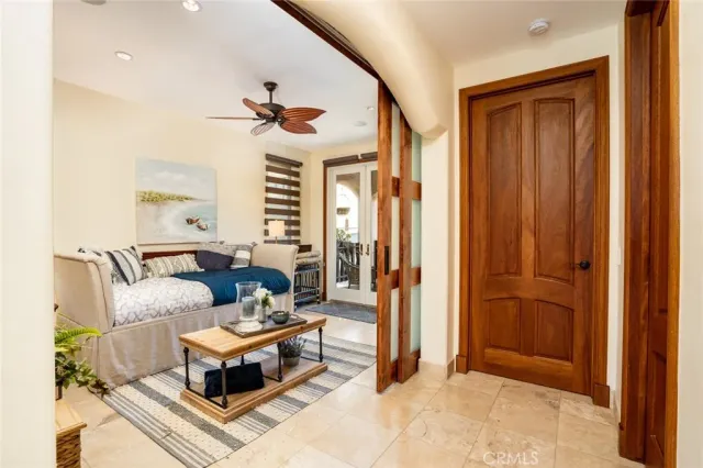 a living room with furniture fireplace and a large window