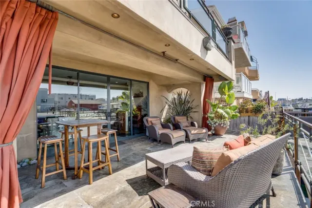 a outdoor living space with patio furniture and a potted plant