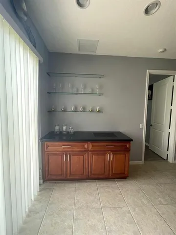 a large kitchen with granite countertop cabinets and a sink