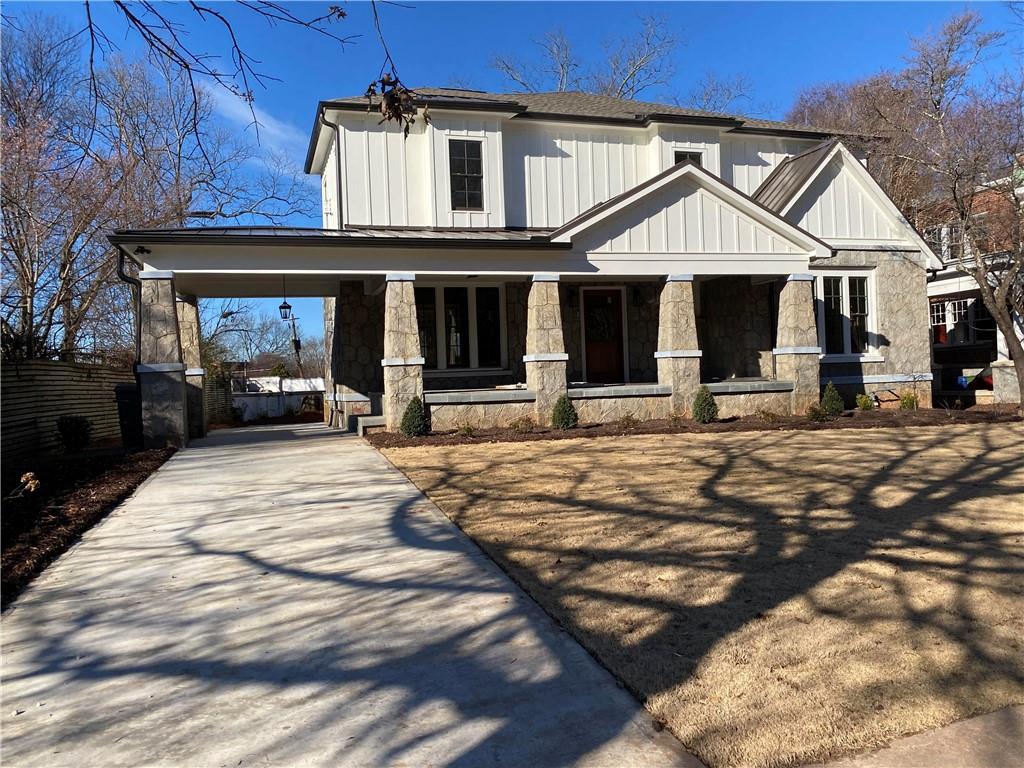 20 Kirkwood Road Northeast Atlanta, GA 30317 - Photo 1 of 1 20 Kirkwood Road Facade---A stately 1927 Granite Home Rebuilt in 2020. The original Port-au-cacher leads to the new 2 car, rear-entry garage. This magnificent front porch with Pennsylvania Bluestone Floor and stained tongue & groove ceiling is perfect for receiving guests or visiting with your neighbors.