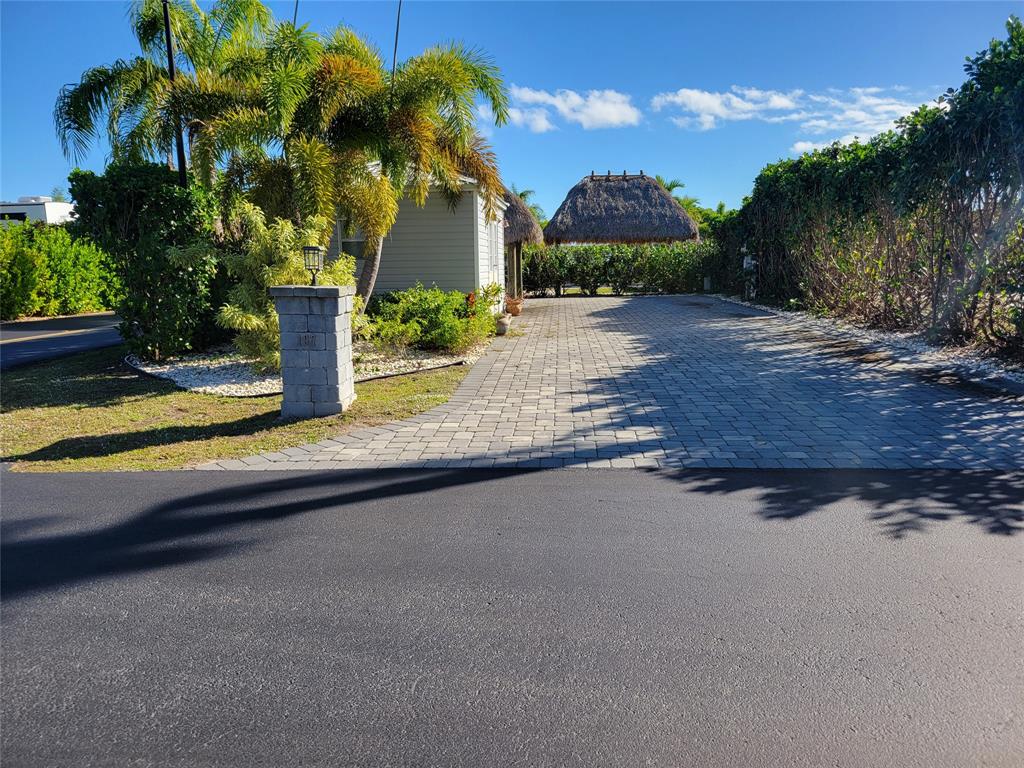 3528 Southwest 7th Street Okeechobee, FL 34974 - Photo 2 of 12 a view of a house with pool plants and palm trees