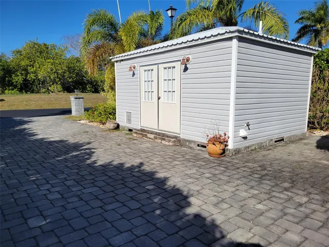 a view of a house with a yard and a garage