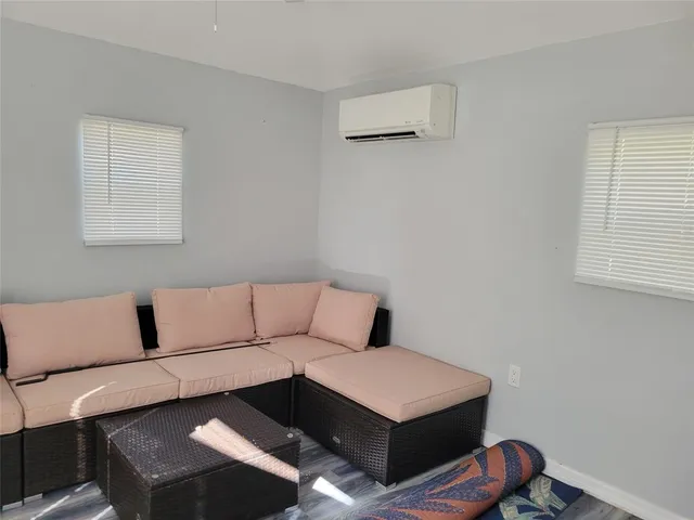 a living room with a couch and a window