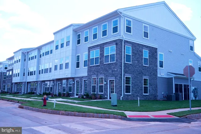 a view of a building with a yard