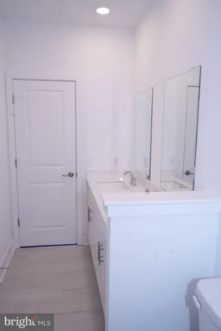 a bathroom with a sink and vanity