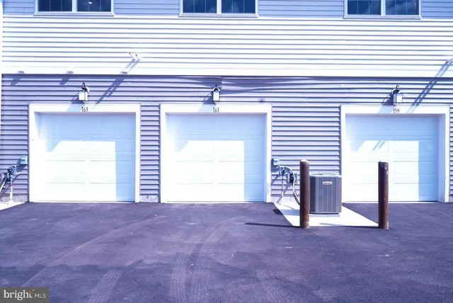 a view of a livingroom with a fireplace and window