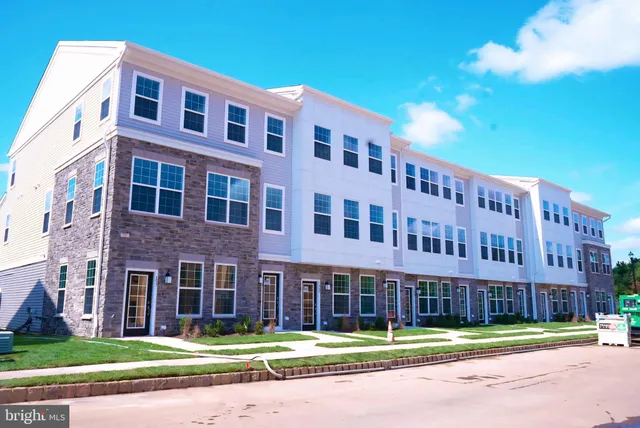 a view of a building with a yard