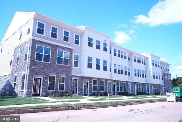 a view of a building with a yard