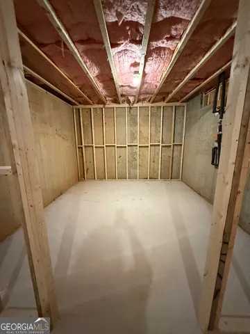 a view of a room with wooden walls