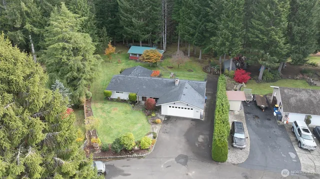 an aerial view of a house with outdoor space