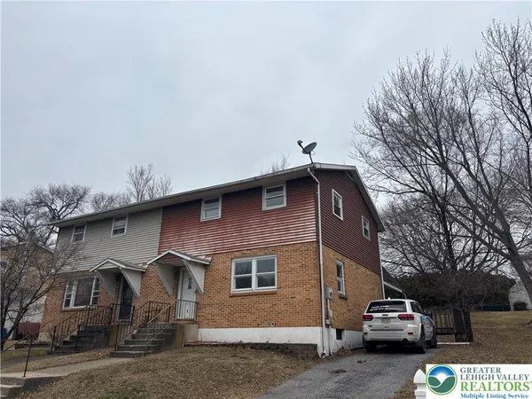 a car parked in front of a house