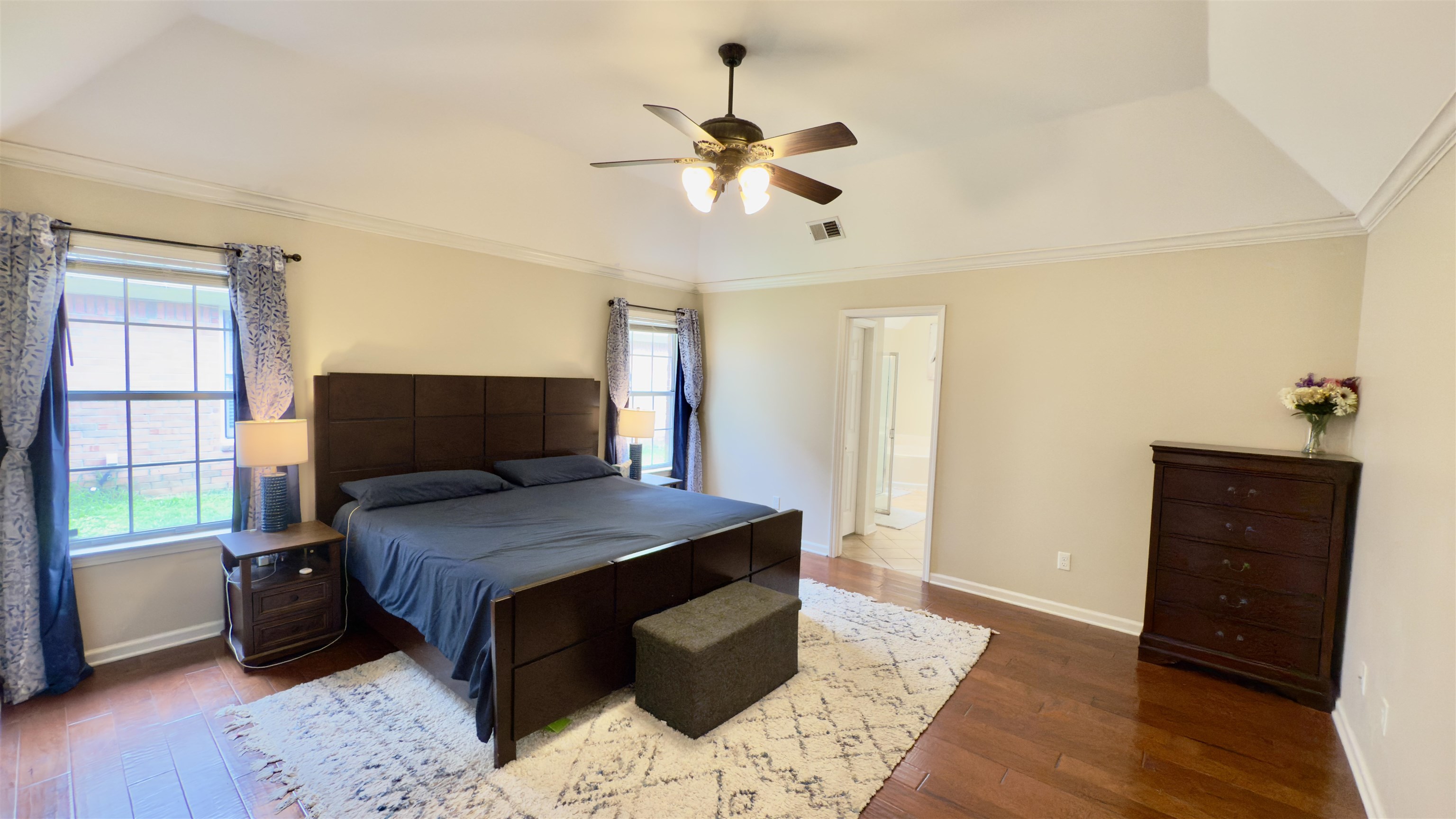 1082 Sugar Lane Collierville, TN 38017 - Photo 11 of 25 a bedroom with a bed and wooden floor
