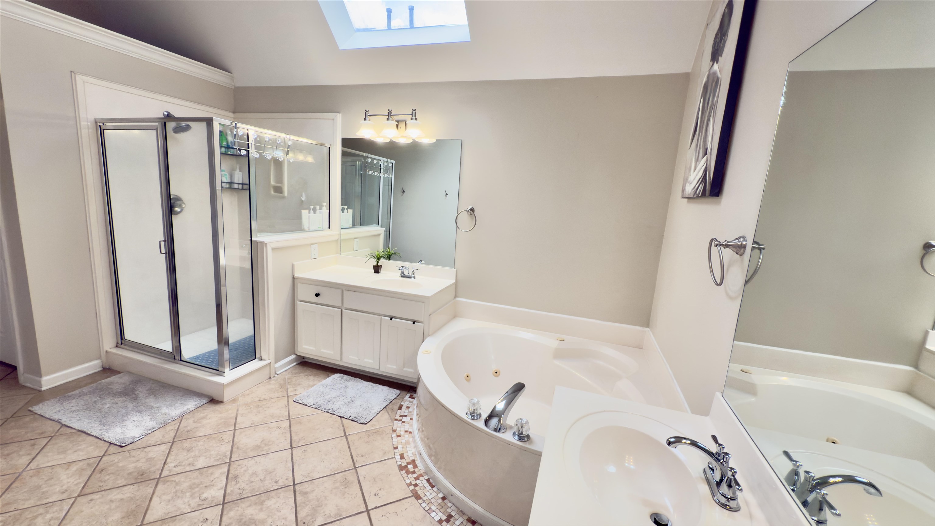 1082 Sugar Lane Collierville, TN 38017 - Photo 13 of 25 a spacious bathroom with a tub sink and mirror