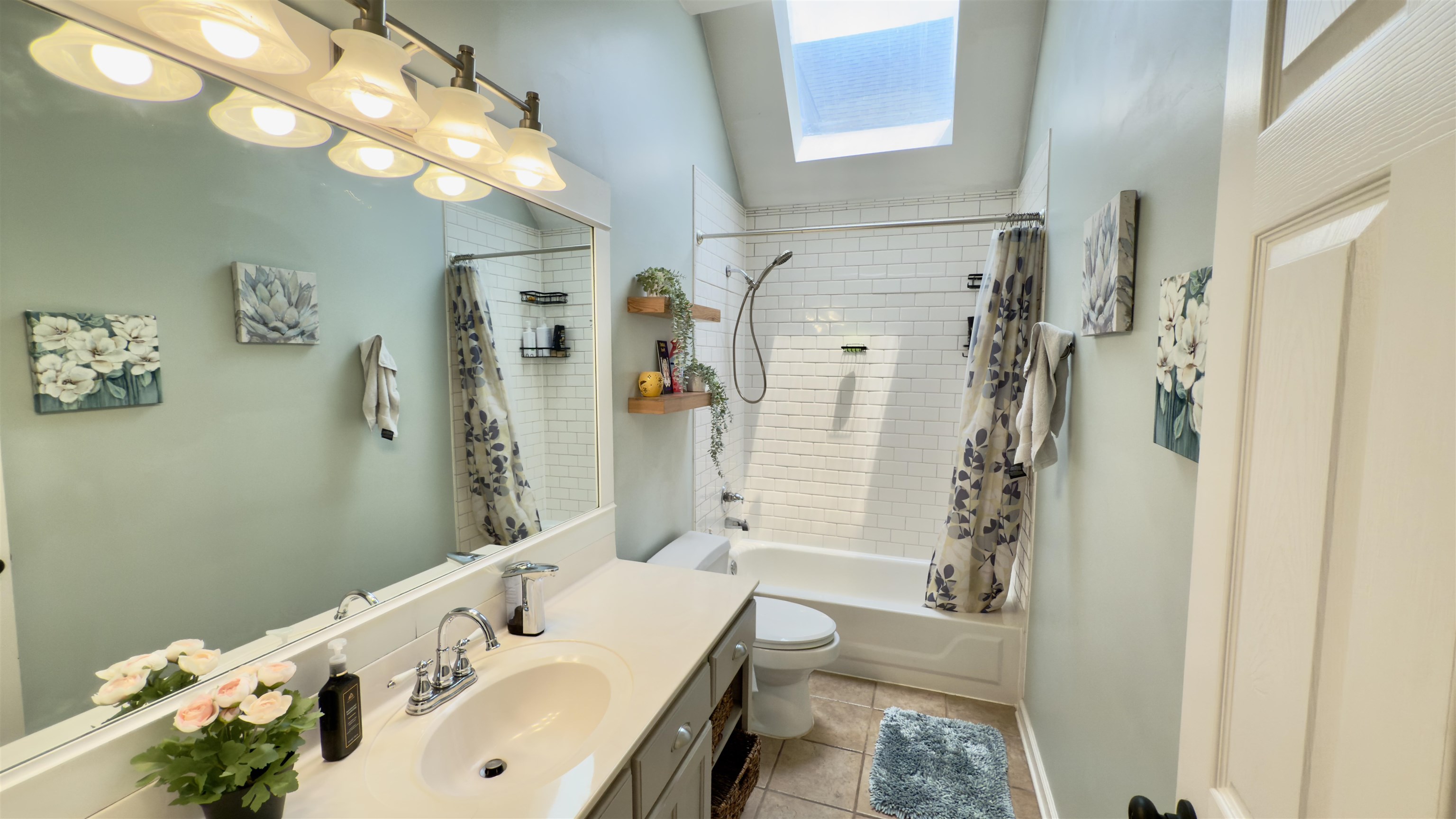 1082 Sugar Lane Collierville, TN 38017 - Photo 15 of 25 a bathroom with a tub sink and mirror