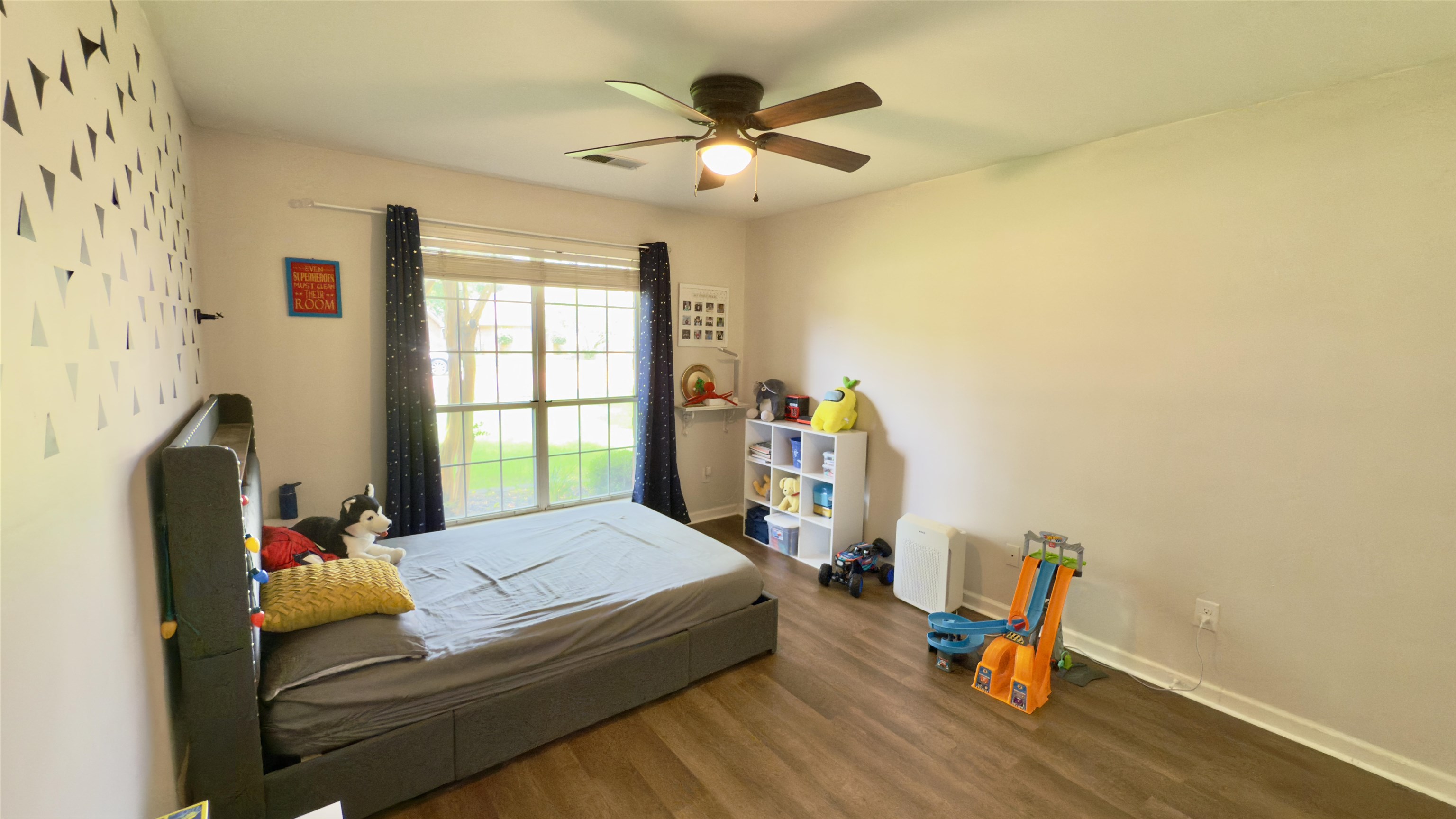 1082 Sugar Lane Collierville, TN 38017 - Photo 16 of 25 a bed room with a bed and a chandelier