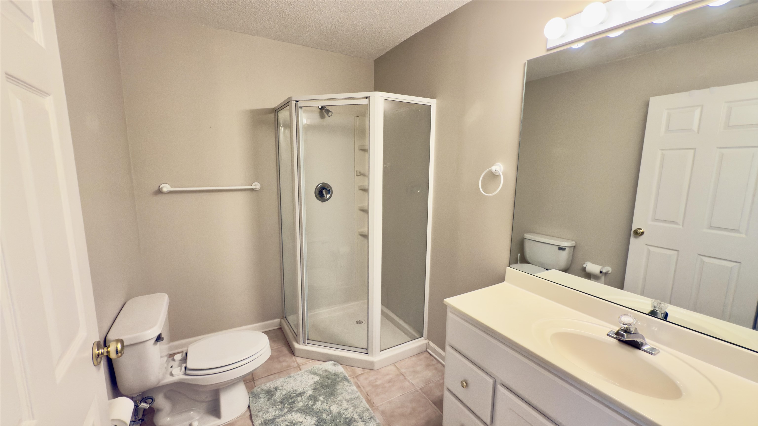 1082 Sugar Lane Collierville, TN 38017 - Photo 18 of 25 a bathroom with a sink toilet and shower