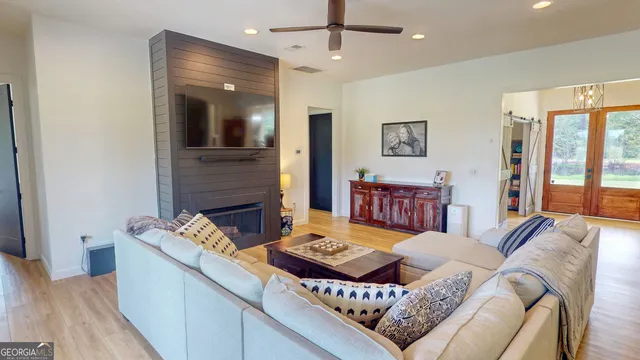 a living room with furniture and a fireplace