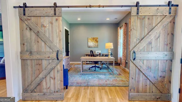 a view of entryway dining room and hall with wooden floor
