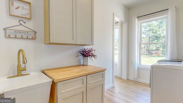 a view of a patio with a table chairs and a swimming pool
