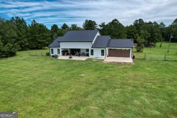 a view of a garden with an outdoor seating