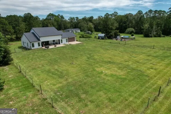 a aerial view of a houses with a lake view