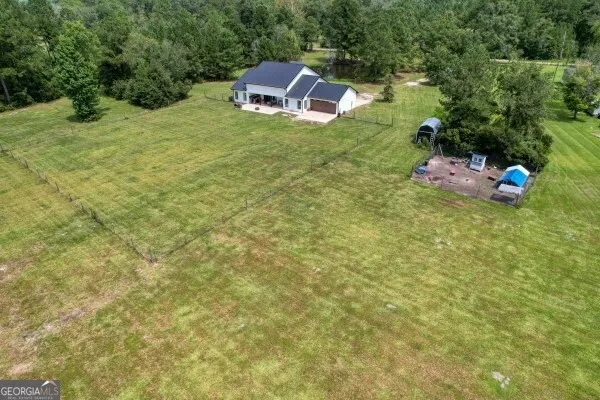 a aerial view of a houses with a lake view