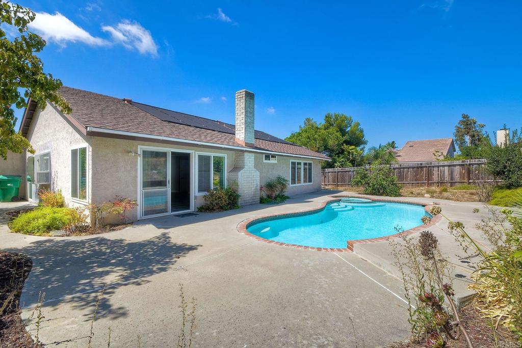 6428 El Perico Lane Carlsbad, CA 92009 - Photo 2 of 35 a front view of a house with a yard